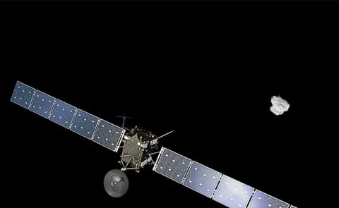 Kuvassa Rosetta-luotain avaruudessa, taustalla komeetta